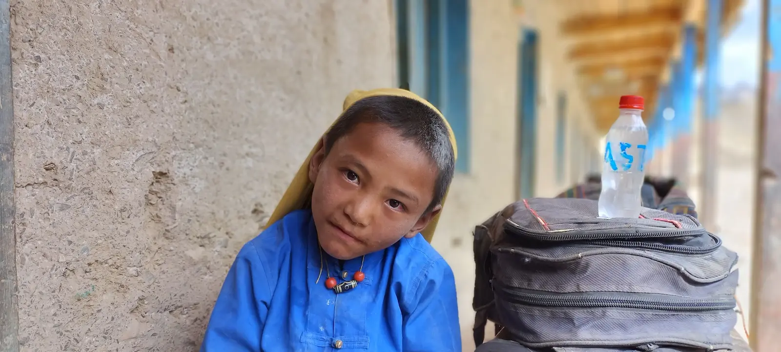 Student from Nyisal village looking intently.